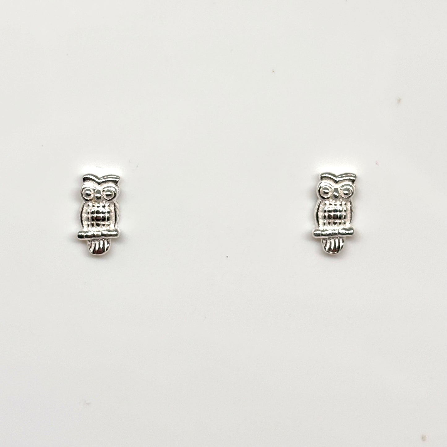 Pair of silver owl-shaped earrings from Pixi Daisy