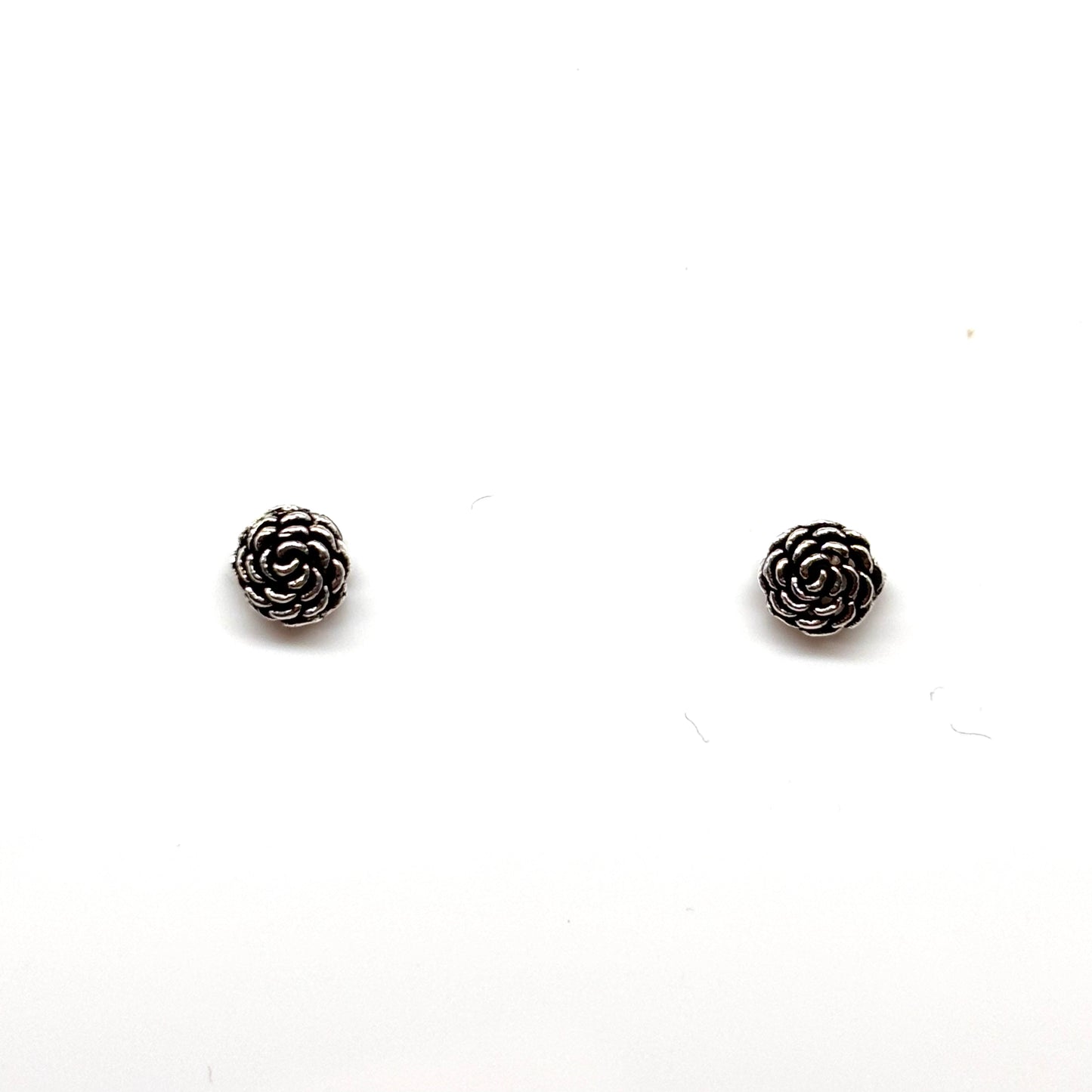 Pair of silver rose-shaped earrings from Pixi Daisy