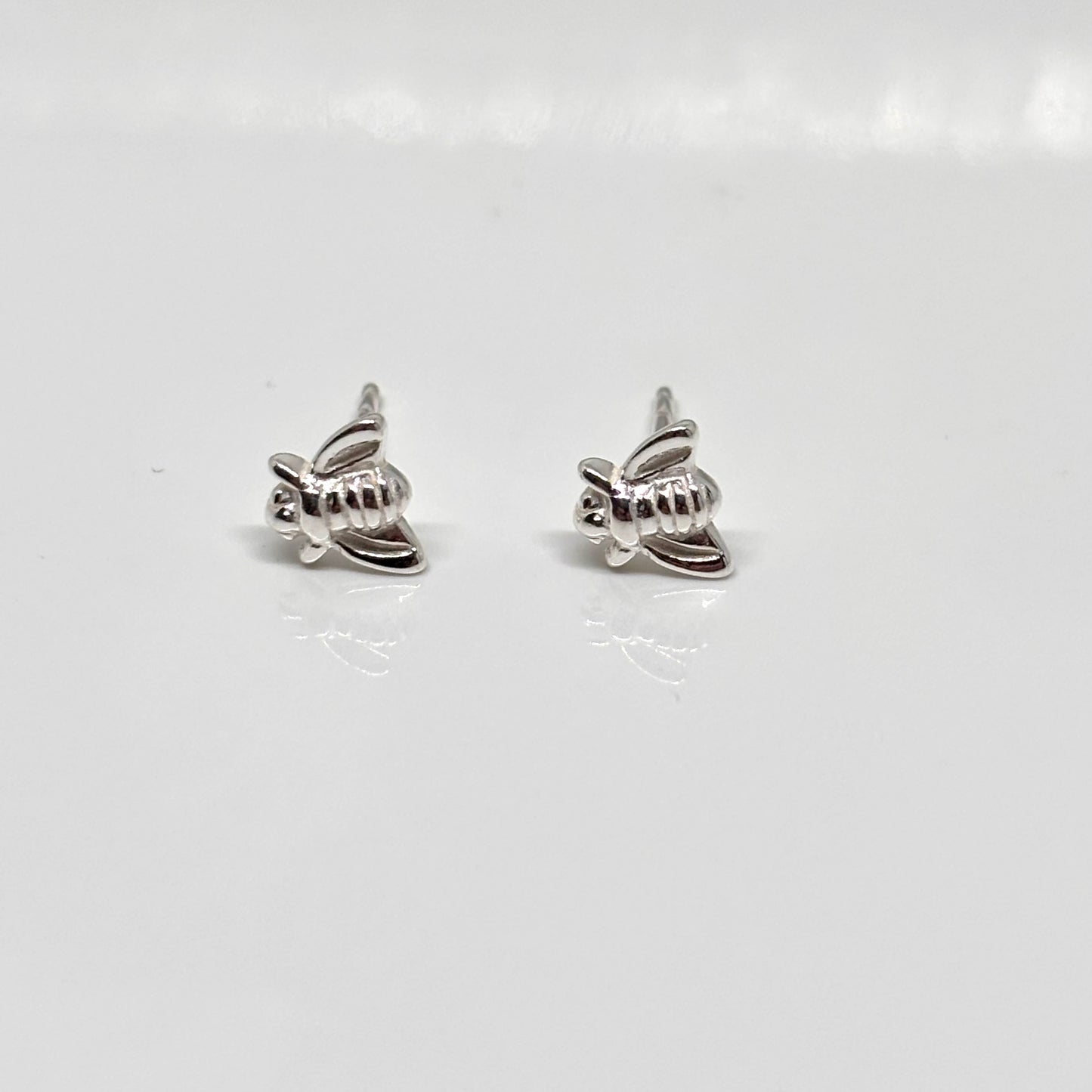 Pair of silver bee-shaped earrings from Pixi Daisy