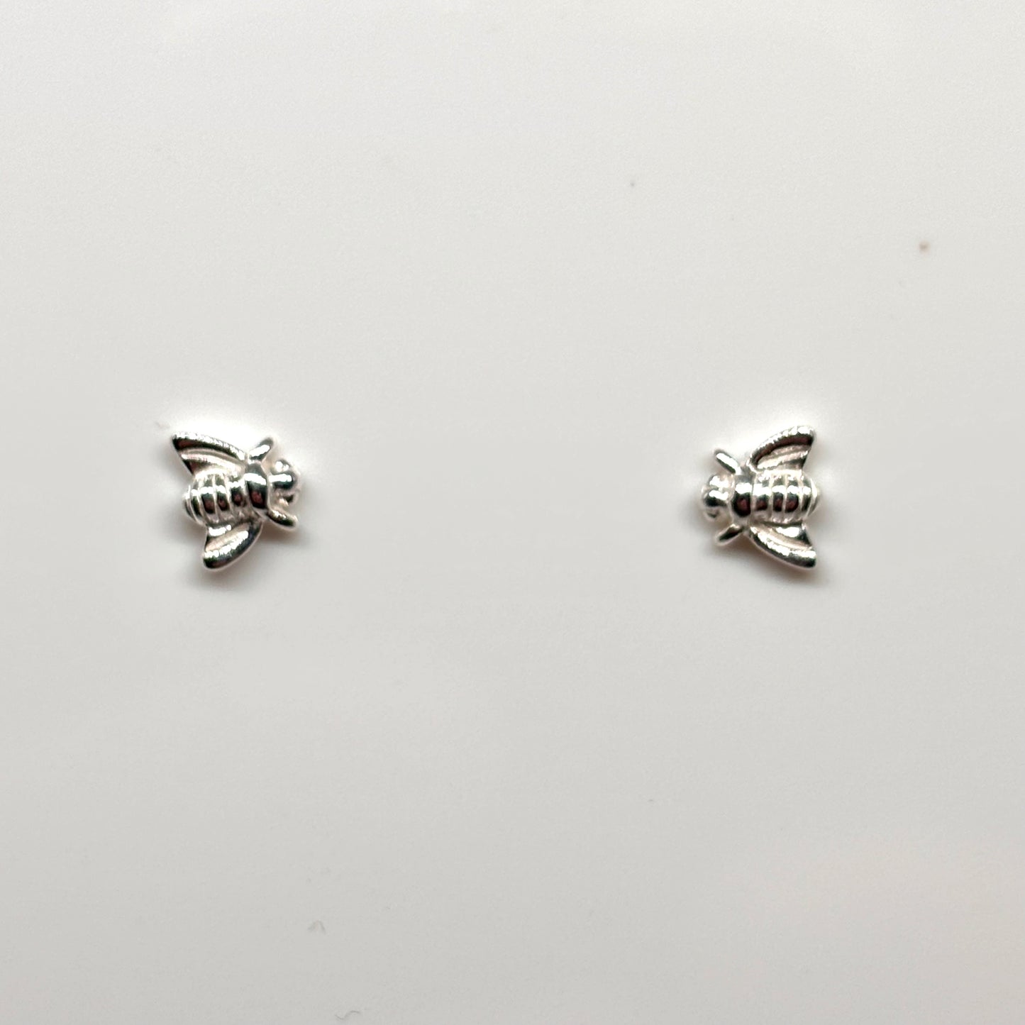 Pair of silver bee-shaped earrings from Pixi Daisy