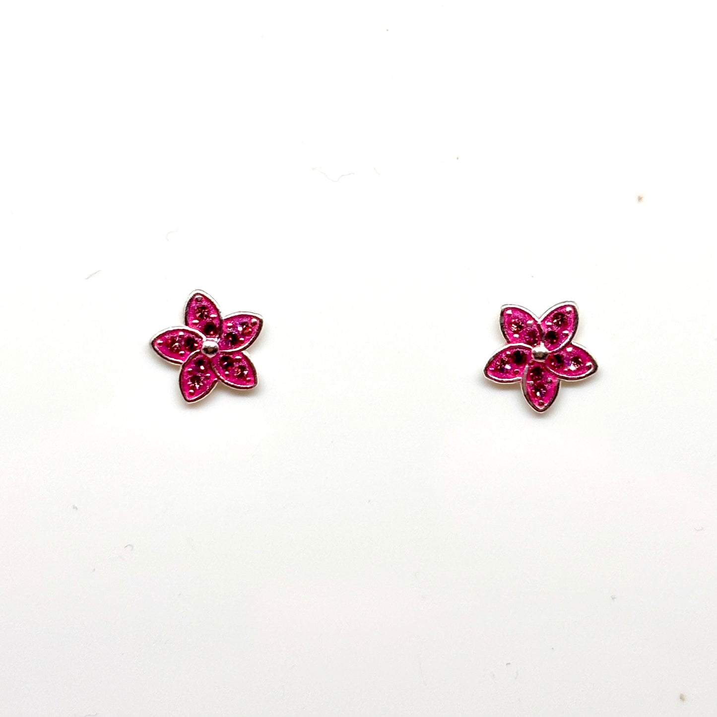 Pair of pink flower-shaped earrings from Pixi Daisy