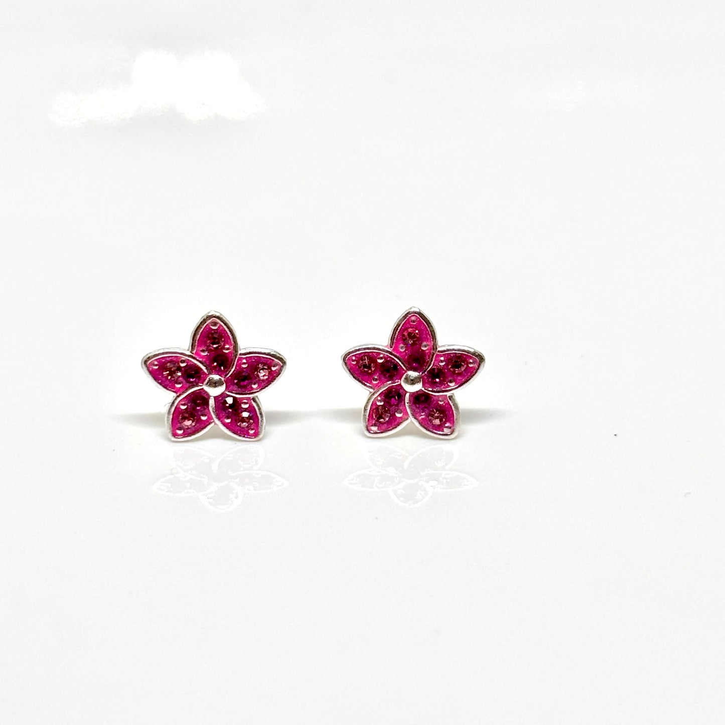 Pair of pink flower-shaped earrings from Pixi Daisy