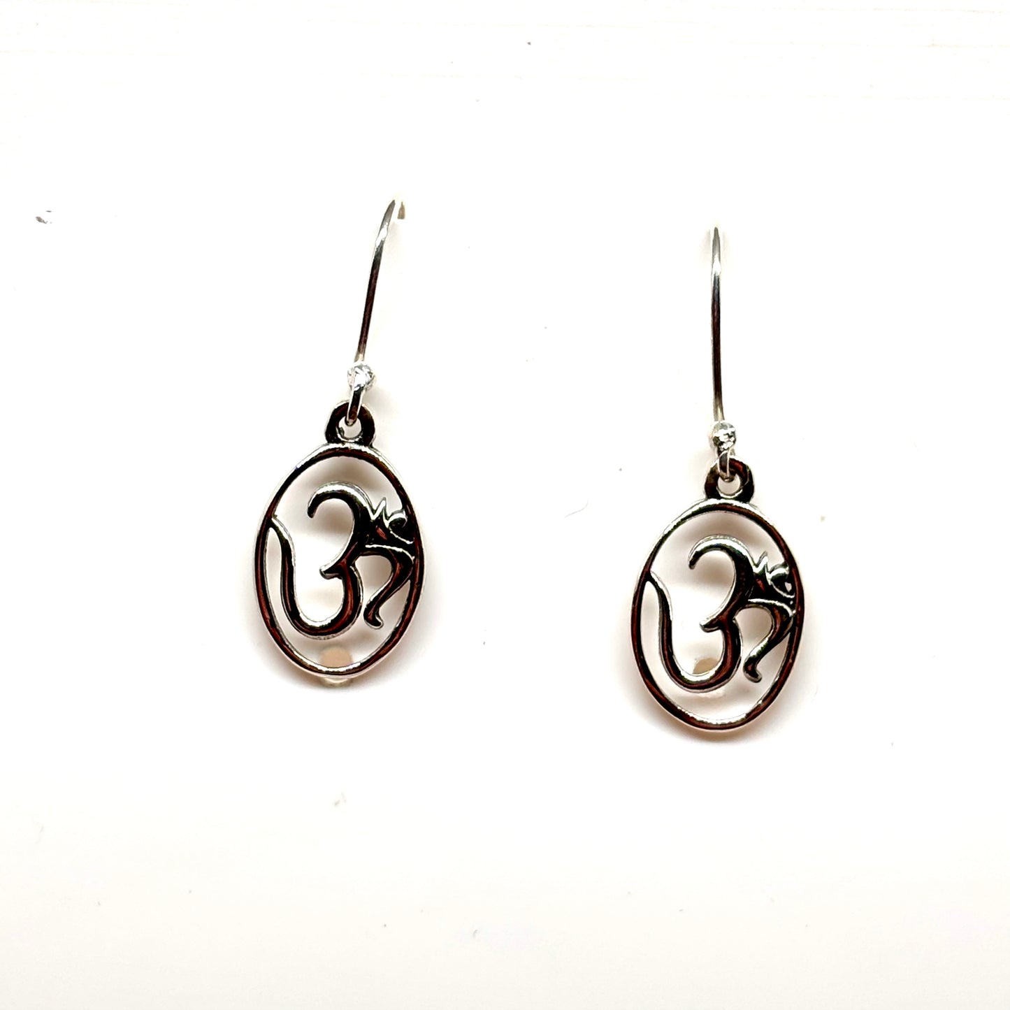 Dangly Om symbol Sterling Silver earrings from Pixi Daisy