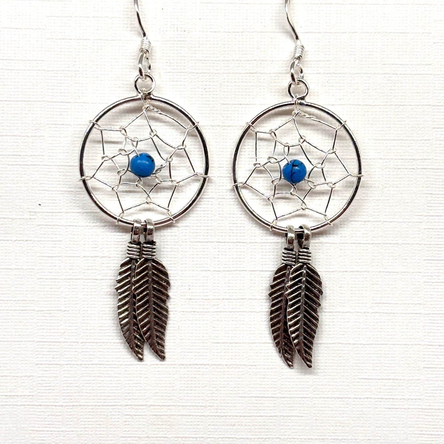 Dreamcatcher earrings with blue bead and feathers from Pixi Daisy