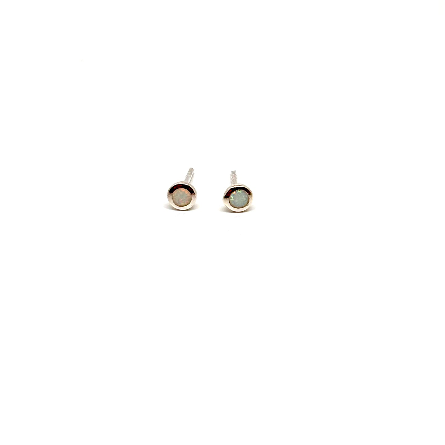 Pair of round white opal earrings from Pixi Daisy