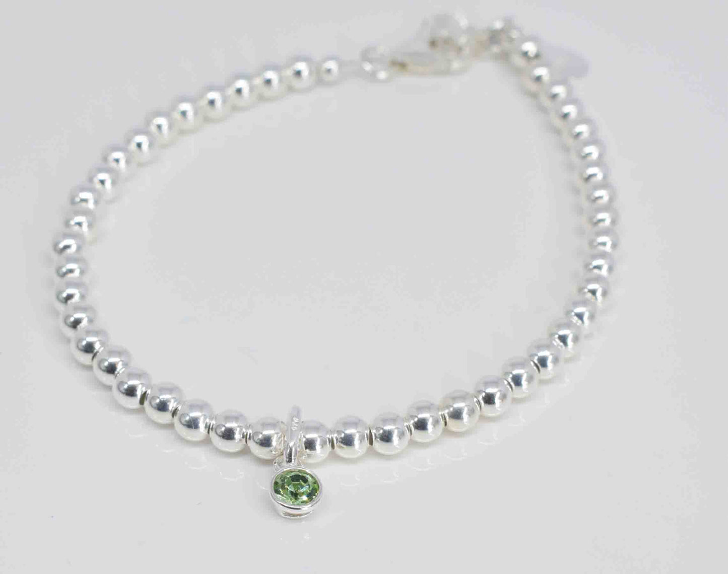 Handmade silver bracelet with peridot charm - Pixi daisy