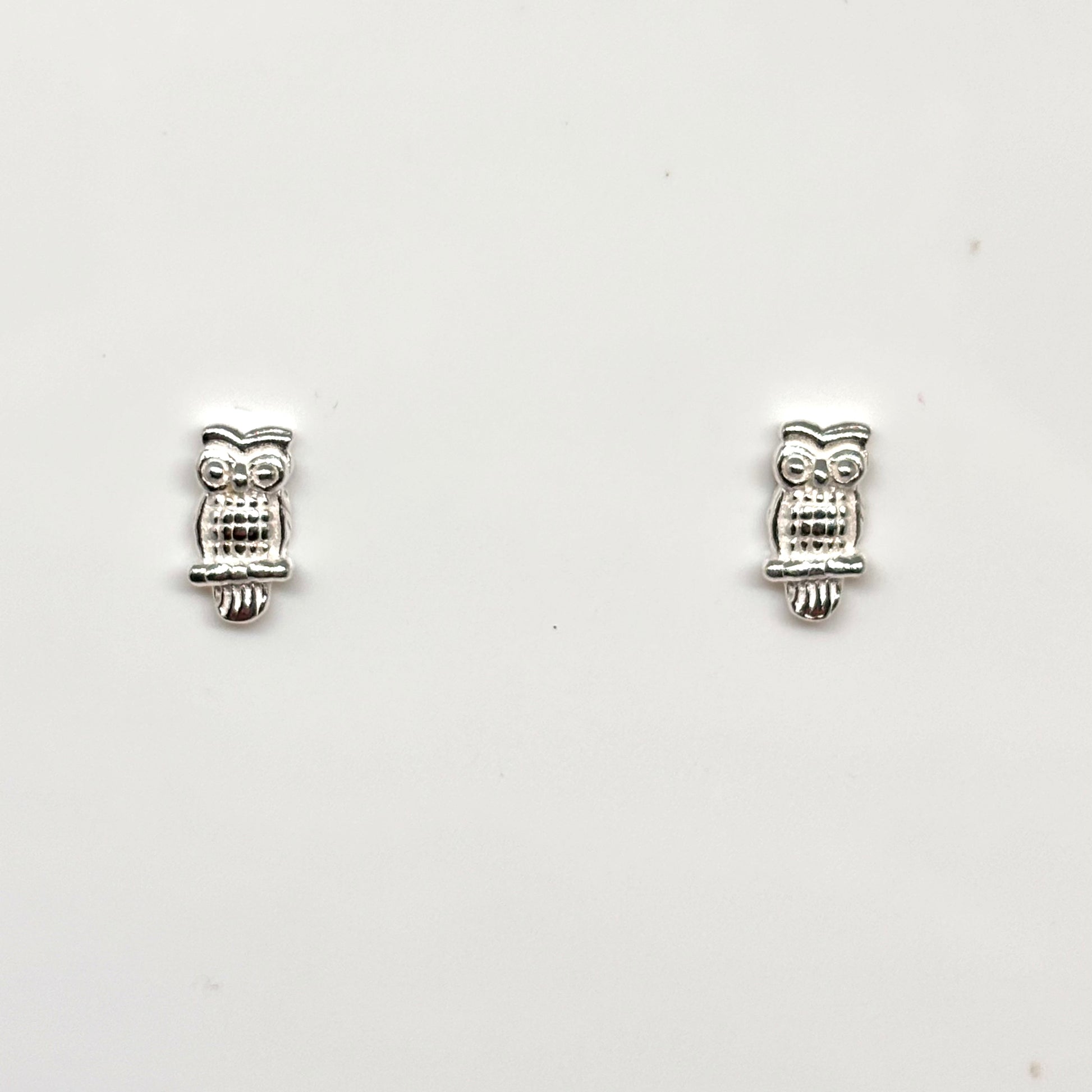 Pair of silver owl-shaped earrings from Pixi Daisy