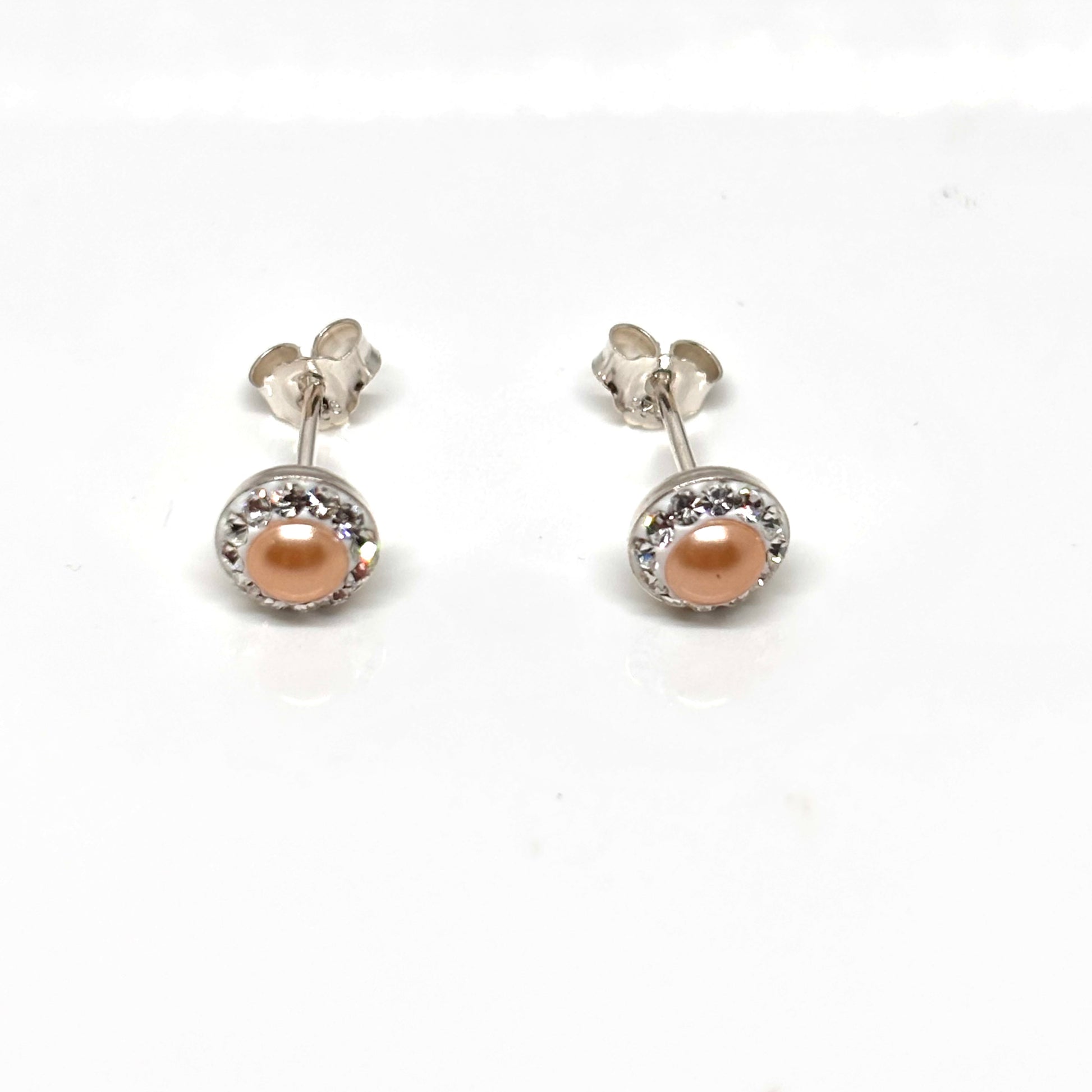 Pair of pearl earrings within a  crystal setting from Pixi Daisy