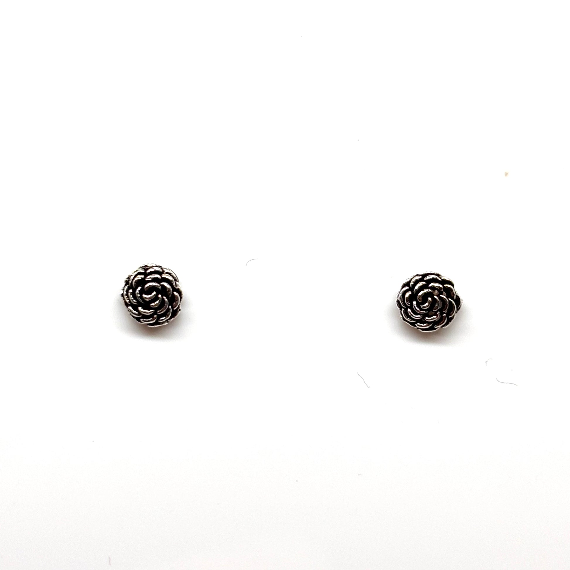 Pair of silver rose-shaped earrings from Pixi Daisy