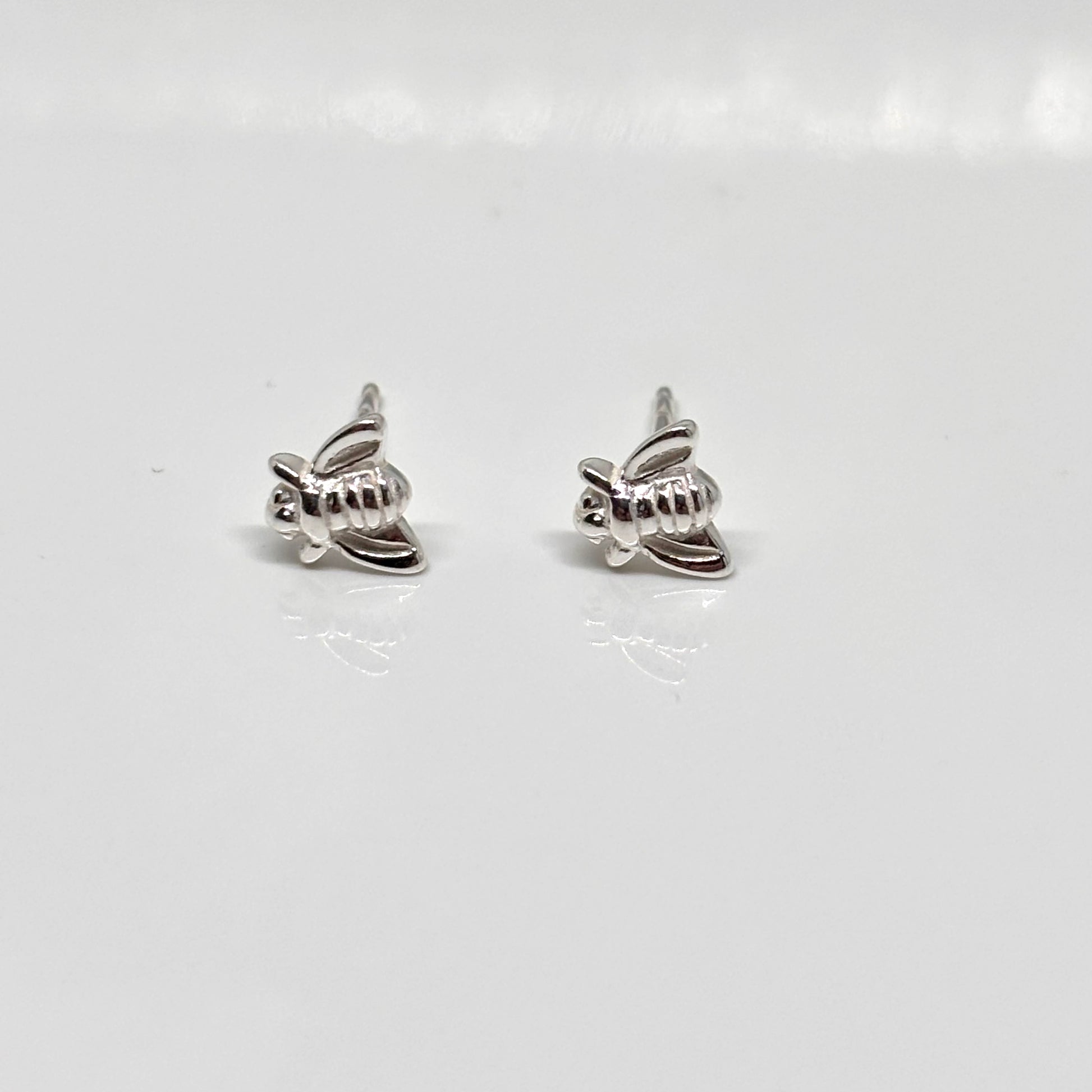 Pair of silver bee-shaped earrings from Pixi Daisy