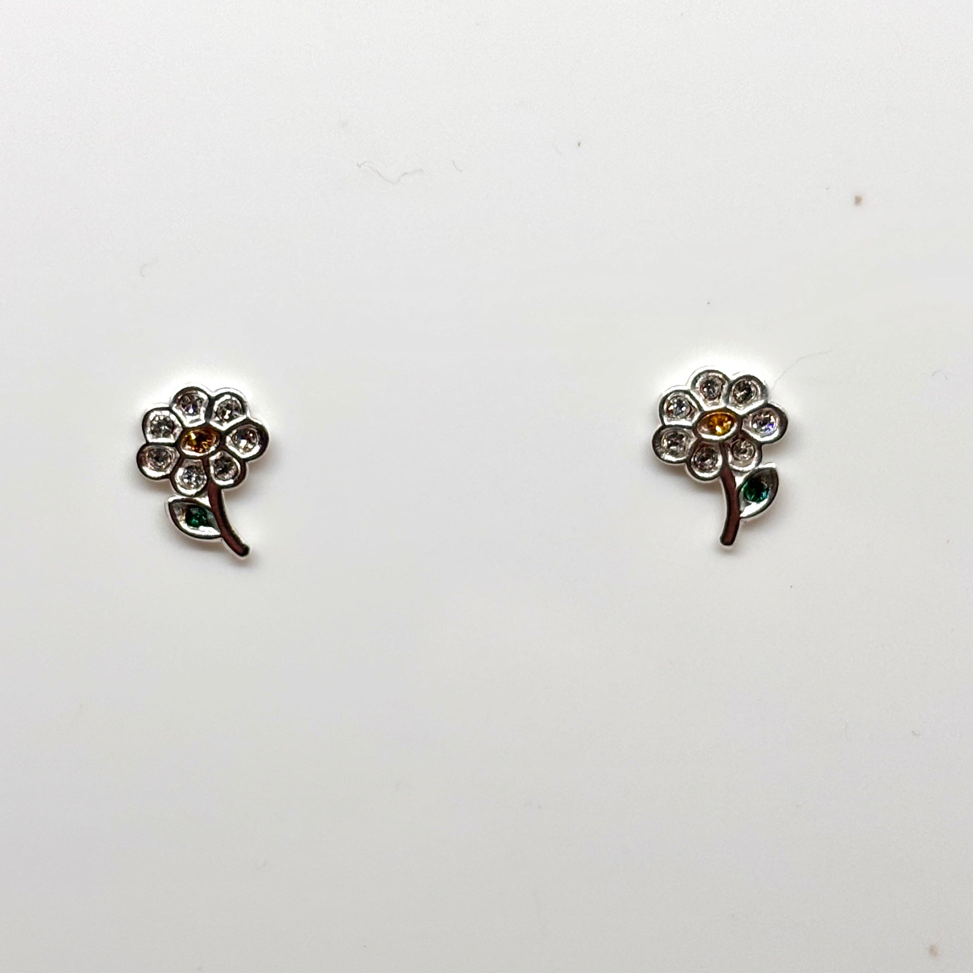Silver flower earrings with embedded crystals from Pixi Daisy