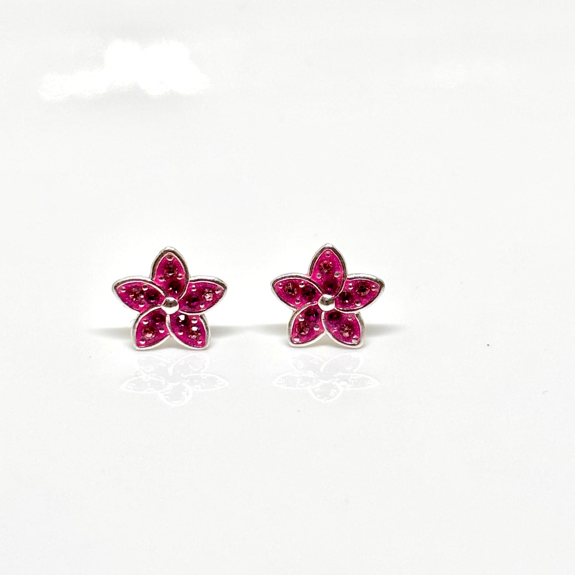 Pair of pink flower-shaped earrings from Pixi Daisy
