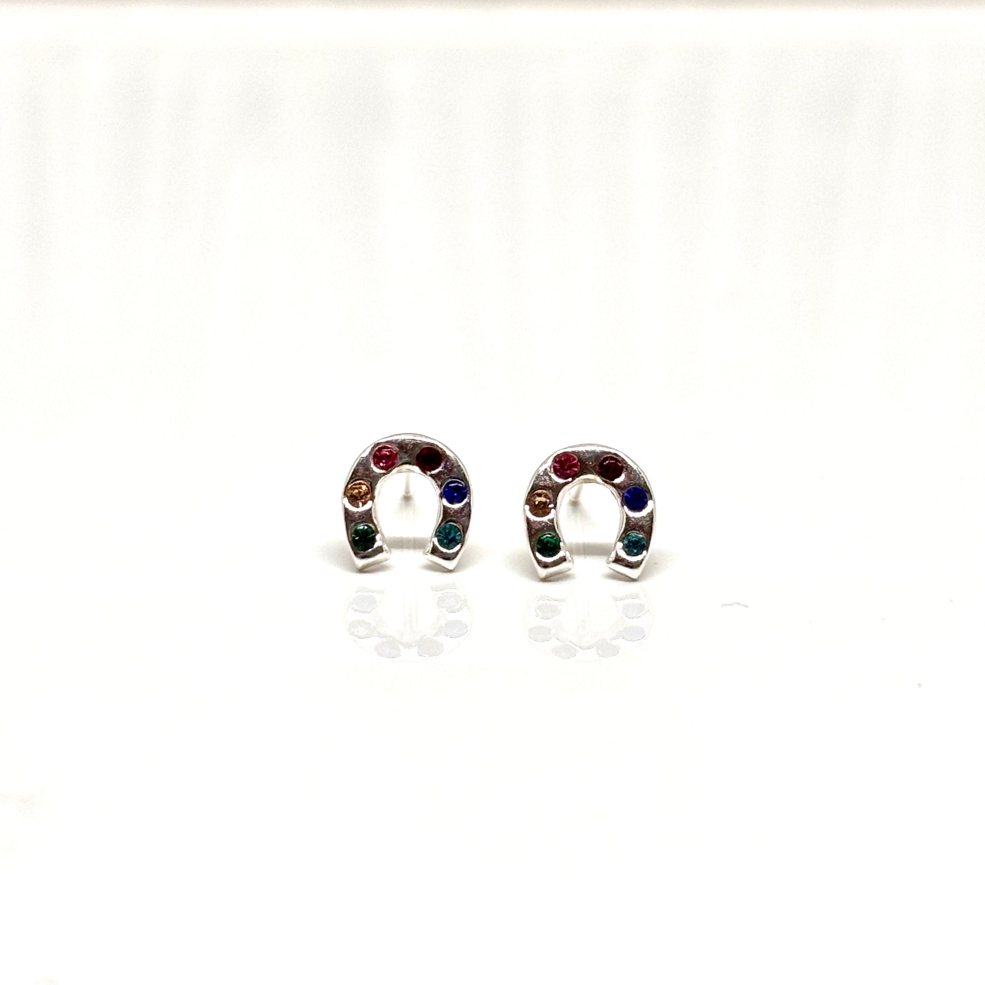 Pair of silver horseshoe-shaped earrings with colourful stones from Pixi Daisy