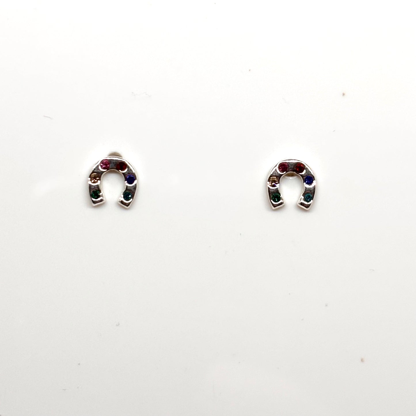 Pair of silver horseshoe-shaped earrings with colourful stones from Pixi Daisy