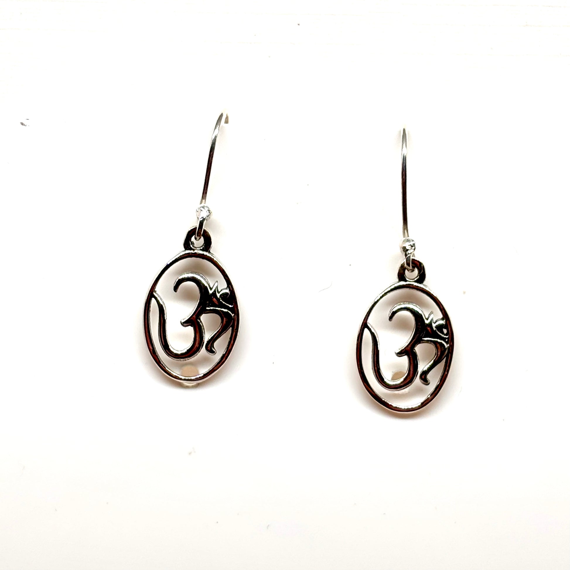 Dangly Om symbol Sterling Silver earrings from Pixi Daisy