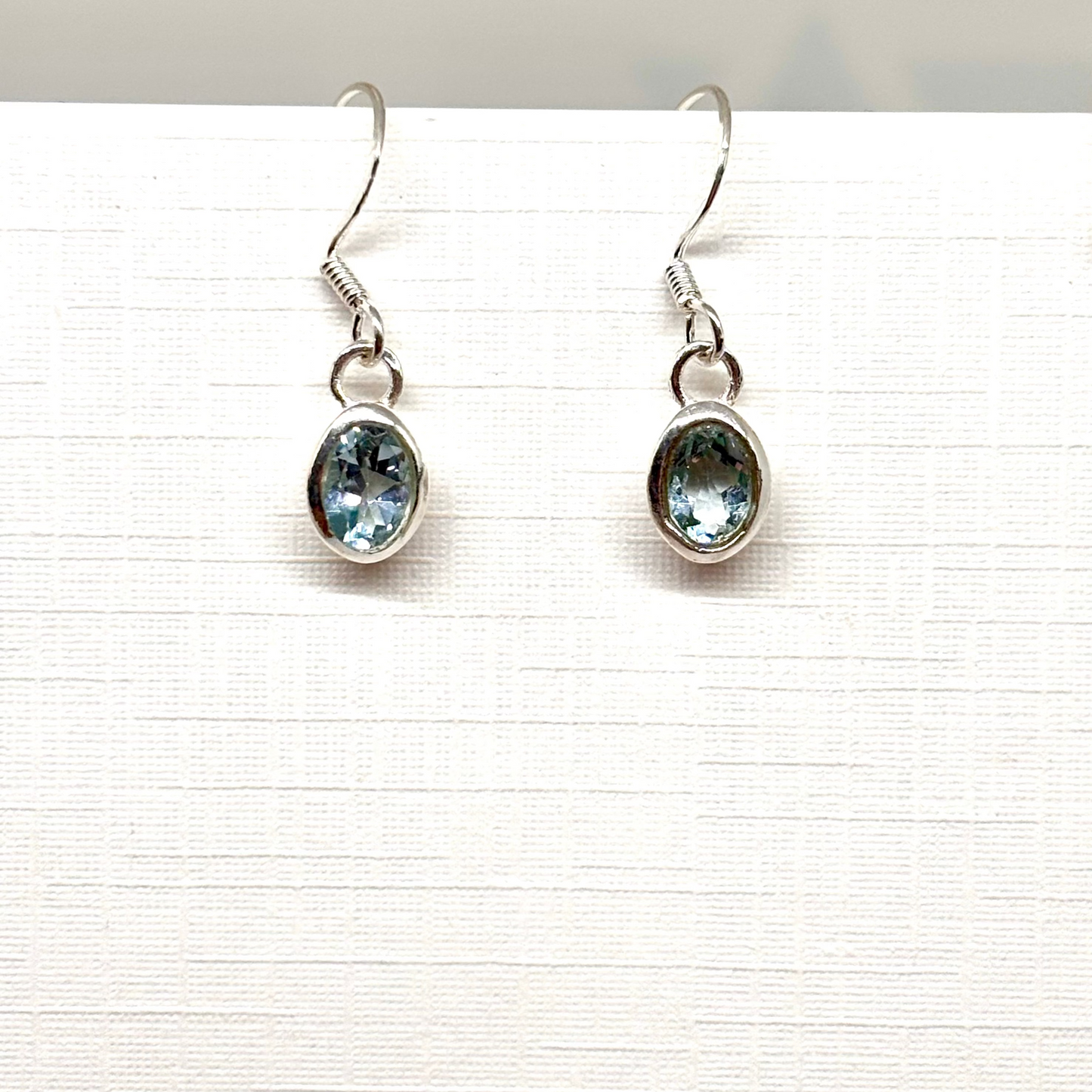 Pair of silver earrings with labradite blue gemstones from Pixi Daisy