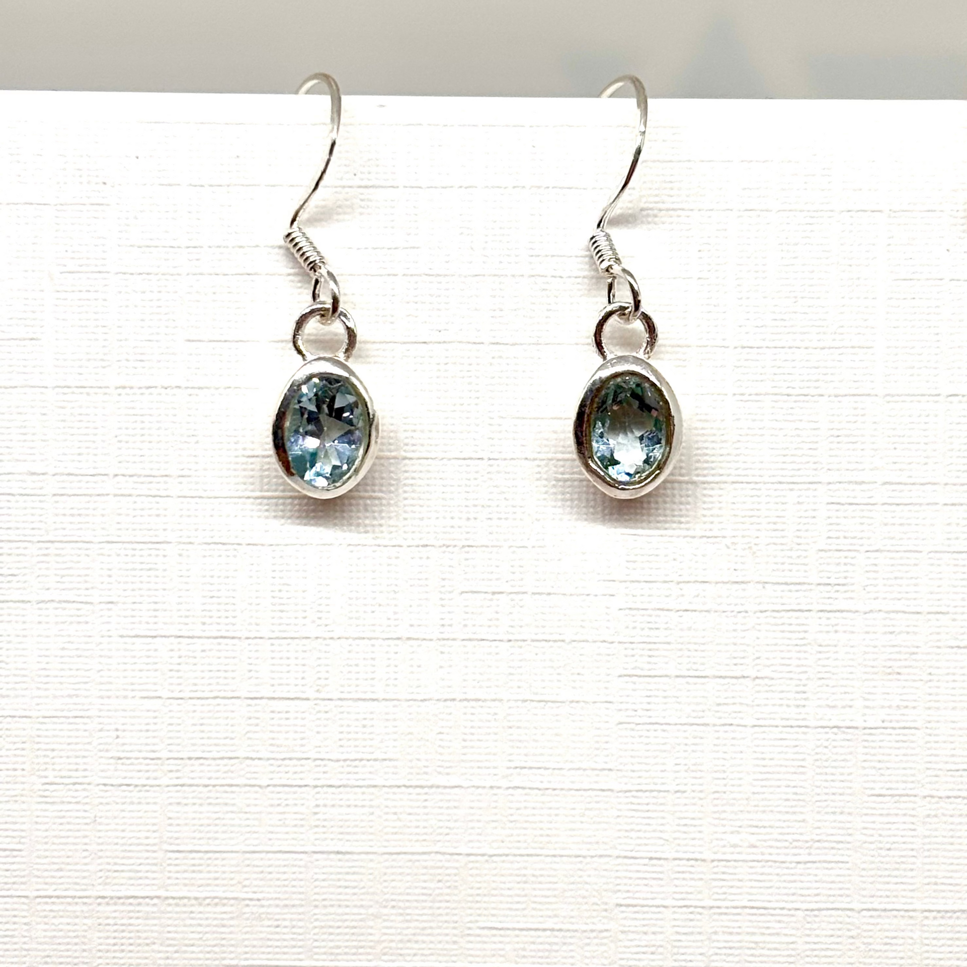 Pair of silver earrings with labradite blue gemstones from Pixi Daisy