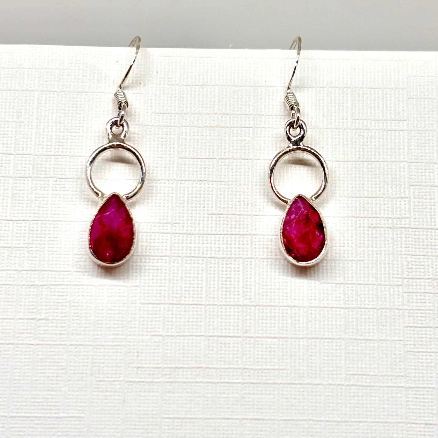 Dark pink teardrop dangly earrings from Pixi Daisy