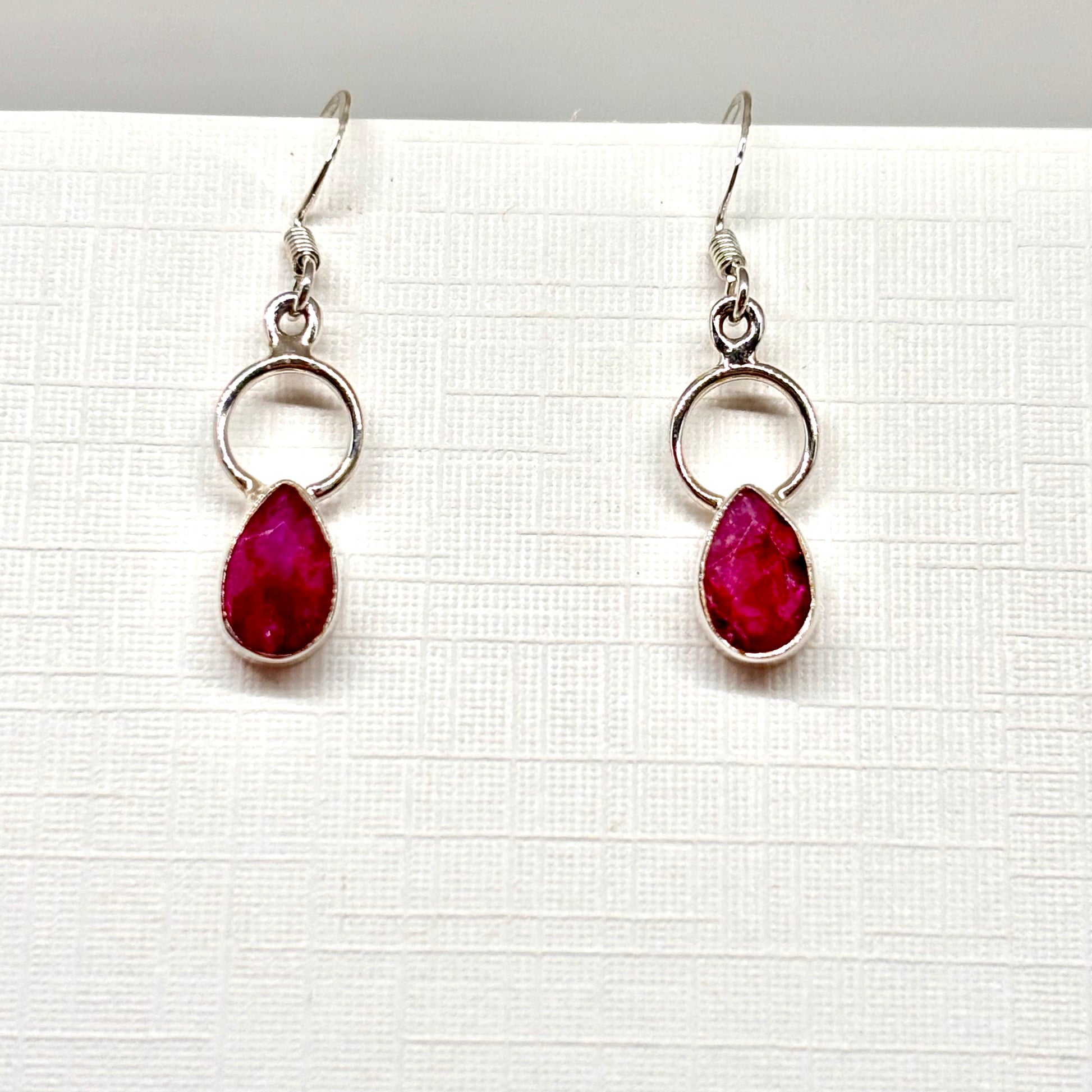 Dark pink teardrop dangly earrings from Pixi Daisy