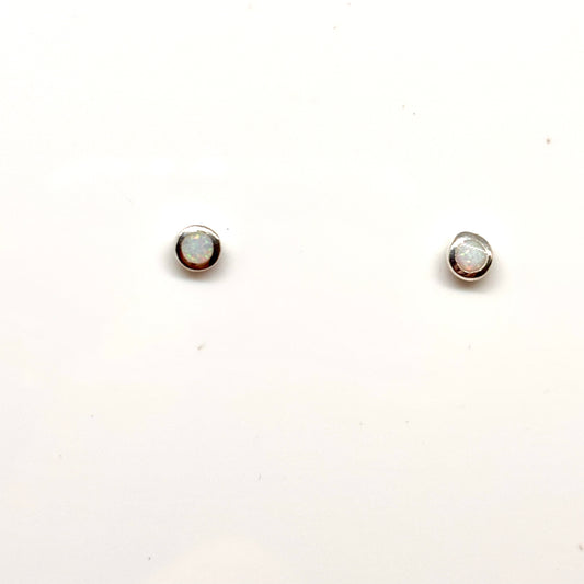 Pair of round white opal earrings from Pixi Daisy
