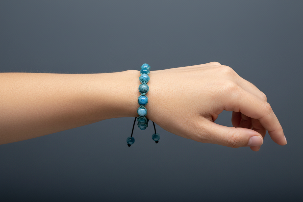 Blue apatite macrame bracelet on model wrist slate grey