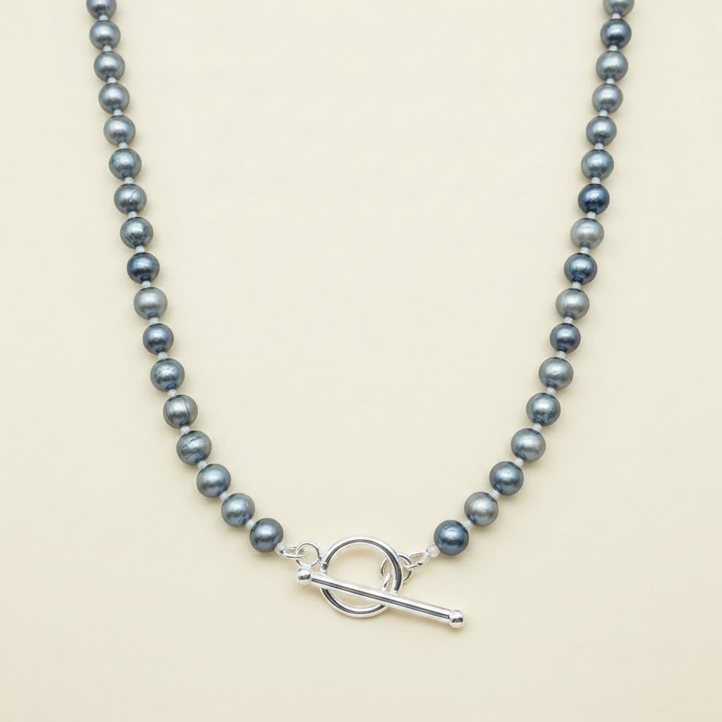 Pearl Necklace Clasp Detail - Cream Background