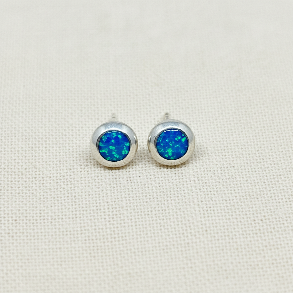 Round Blue Opal Sterling Silver Stud Earrings from Pixi Daisy