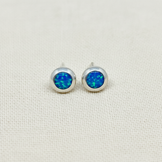 Round Blue Opal Sterling Silver Stud Earrings from Pixi Daisy