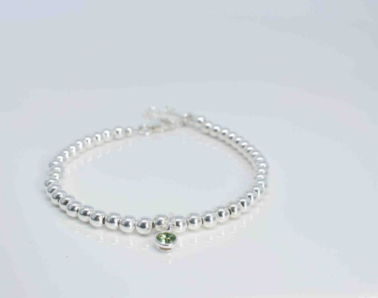 Handmade silver bracelet with peridot charm - Pixi daisy