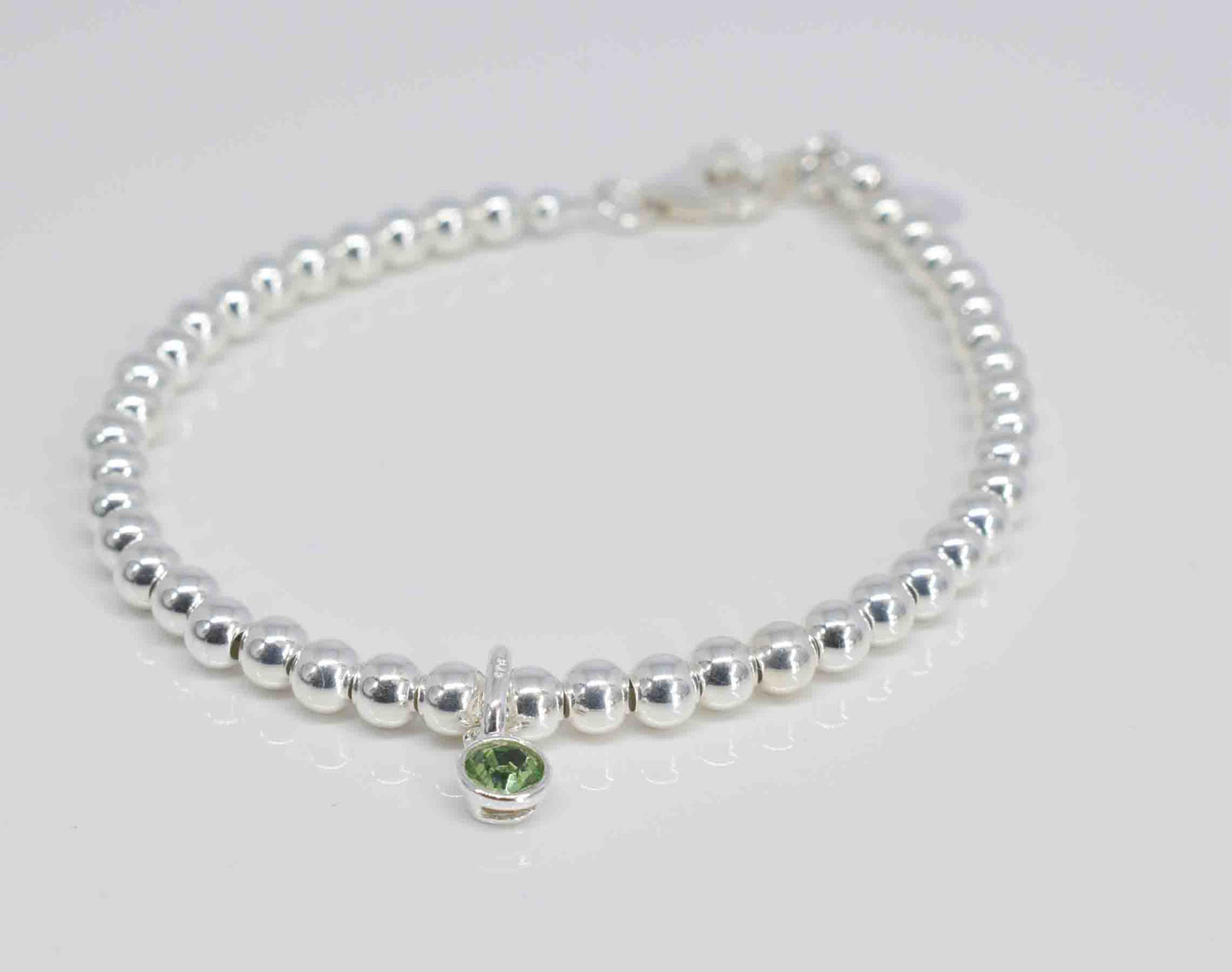 Handmade silver bracelet with peridot charm - Pixi daisy