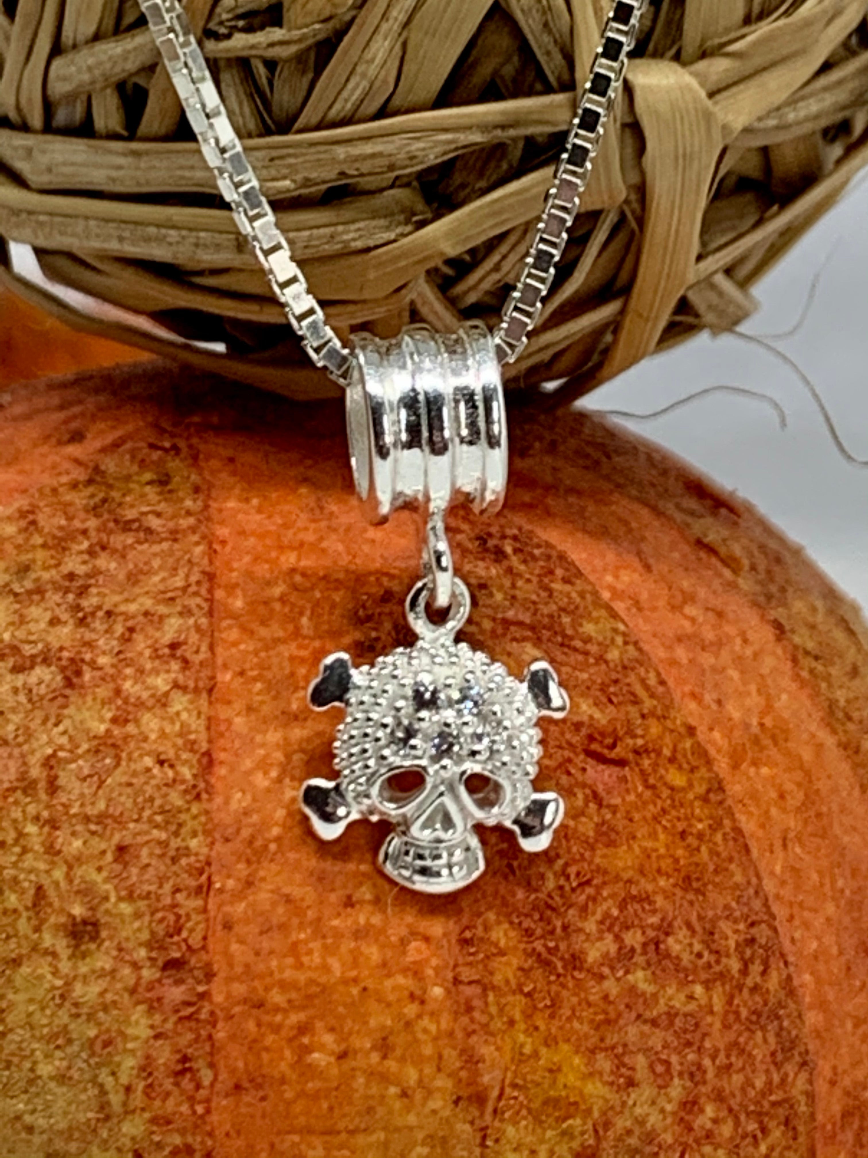 Skull and crossbones on sale pendant